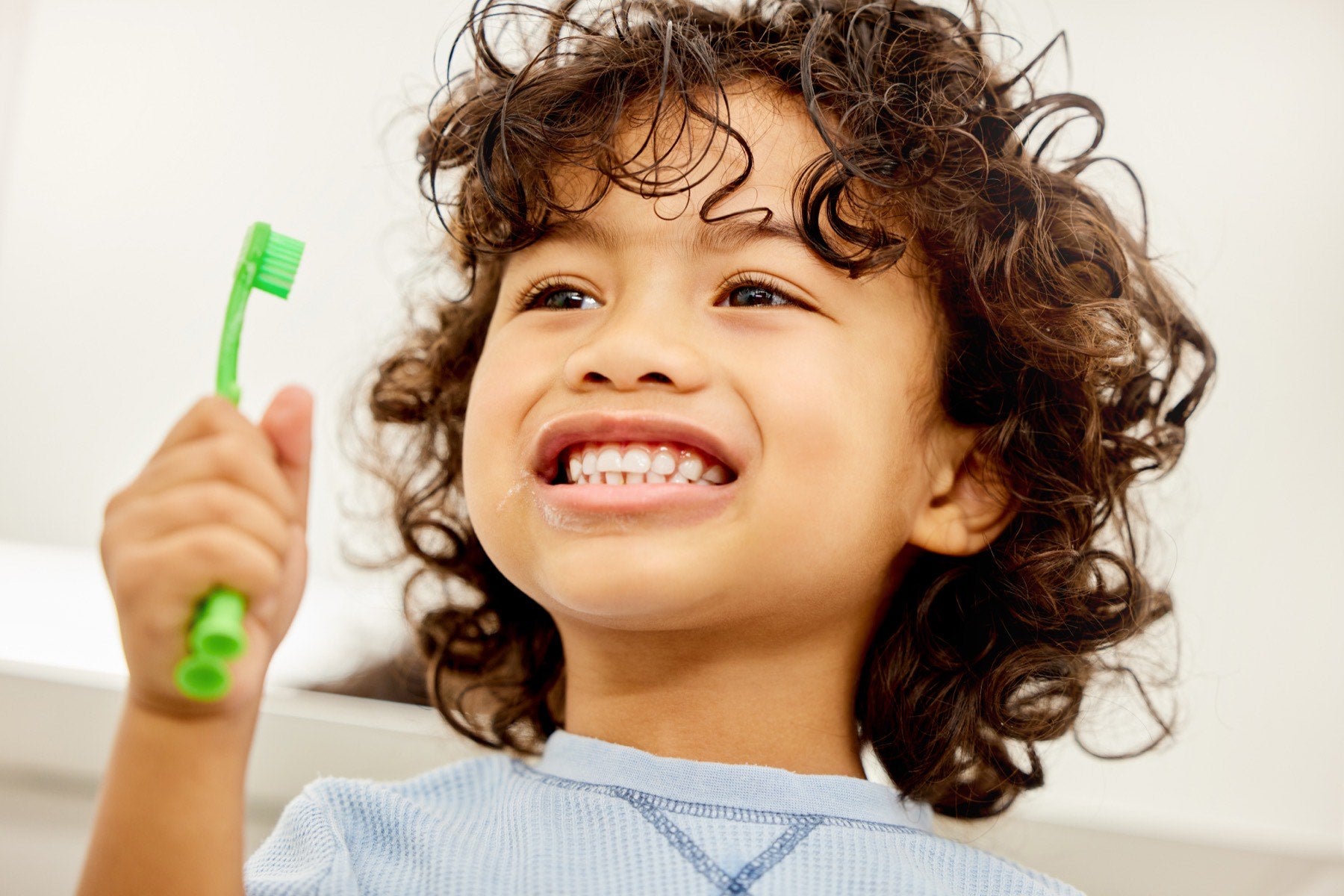 Laughing child with clean teeth